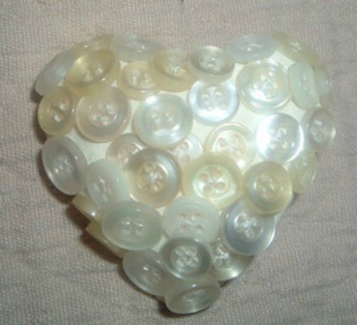 Buttons made into a heart shaped pin.