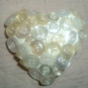 Buttons made into a heart shaped pin.