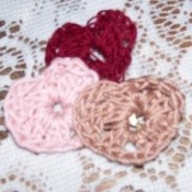 Crocheted hearts in 3 colors.
