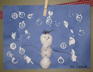 A simple snow scene with paint and cotton balls.