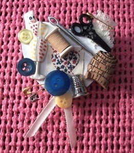 A pin that shows a love of sewing, with lots of buttons and notions displayed.