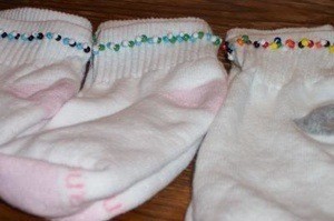 White socks with a beaded trim.
