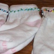 White socks with a beaded trim.