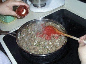 $10 Dinners: Soft Tacos - Adding tomato paste to cooked ground beef
