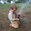 Child Helping with Watering