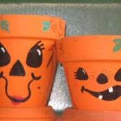 Clay pots decorated with Jack-O-Lantern Faces