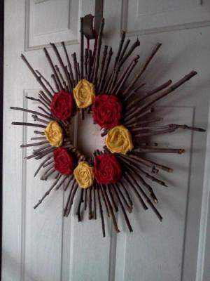 Stick wreath hanging on the front door.