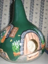 Birdhouse painted gourd.