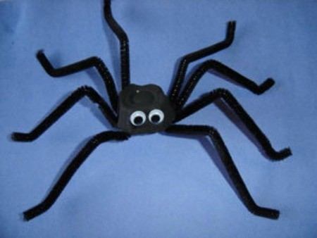 Section of egg carton and pipe cleaner spider.
