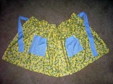 One Yard Apron - yellow floral fabric apron with blue pockets and  ties