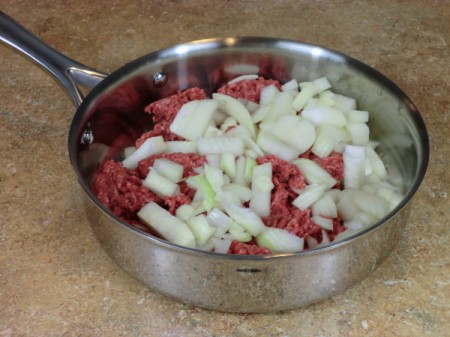 uncooked meat and onions