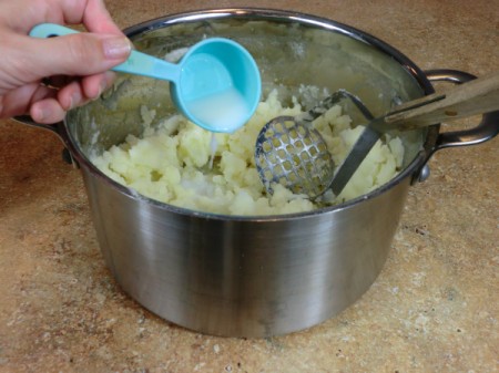 add milk to potatoes