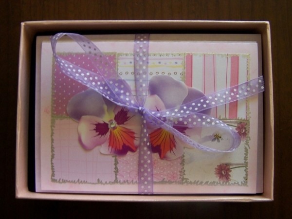 Box of cards tied with lavender polka dot bow.