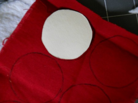 Closeup of tracing berry pattern onto fabric.
