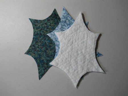 Two fabric leaf pieces with one of the batting.