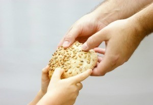 Giving bread to the needy.