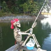 Skeleton fishing from deck.