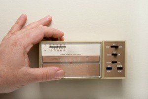 Adjust a home's thermostat.