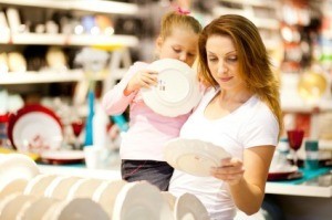 Mother and Daughter Shopping for Dishes