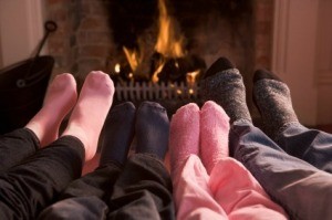 family Warming Feet by Fire