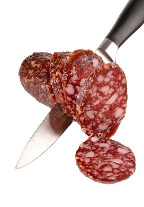 Knife Cutting Summer Sausage