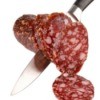 Knife Cutting Summer Sausage