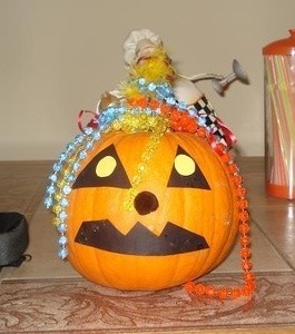 Construction paper decorated jack-o-lantern.