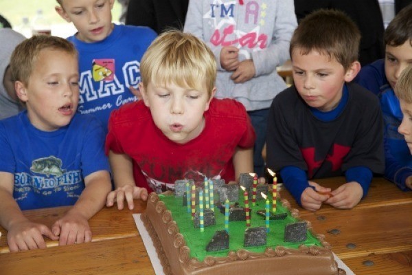 Blowing out the candles on a zombie cake