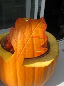 Closeup of leaf on large pumpkin serving bowl.