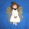 Cute white kitchen angel with gold ribbon wings.