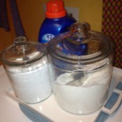 Dry laundry detergent stored in glass canisters.