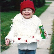 A child dressed as spaghetti and meatballs.