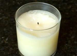 Soy candle in a glass jar.