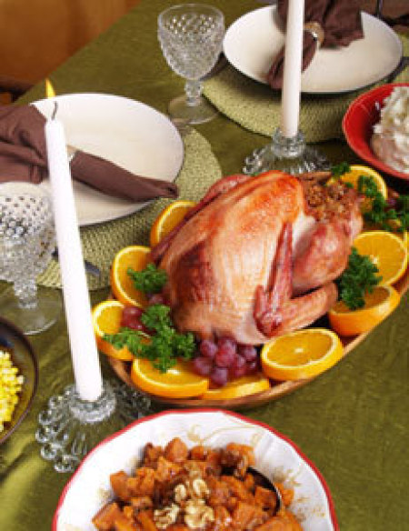 Thanksgiving table with a roasted turkey