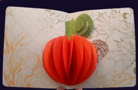A popout orange pumpkin card