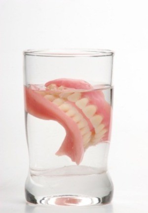 Dentures in a glass of water.