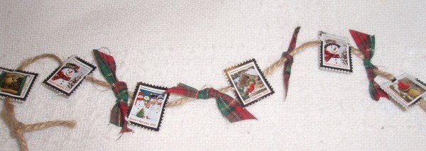 Crafts Made from Christmas Seals - Garland made with seals, cord, and plaid Christmas bows.