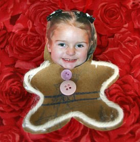 Child's photo attached to gingerbread cutout.