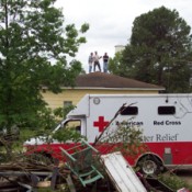 An ambulance outside
wreckage from a
national disaster