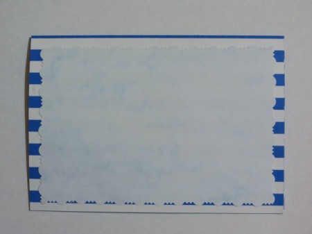 Position and glue the light blue marbled cardstock to the front of the card.