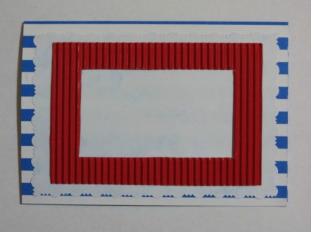 Position and glue the red corrugated frame to the front of the card.