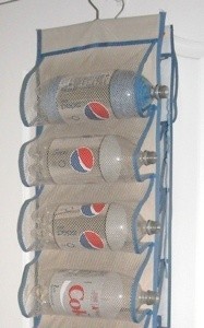 Pop bottles on door shoe holder for yarn storage.
