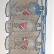 Pop bottles on door shoe holder for yarn storage.