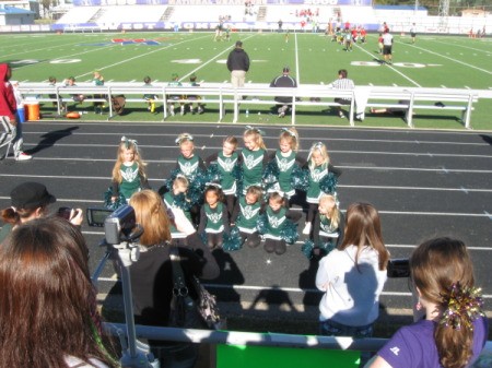 Little cheerleaders at football game.