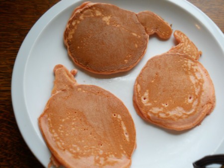 Pumpkin pancakes on plate.