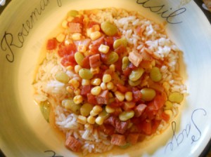 Bowl of succotash over rice.