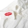 Lipstick stain on a white shirt.
