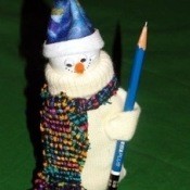 A decorative snowman figure made from a mitten.
