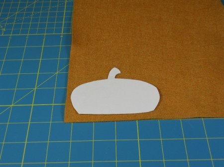 Acorn cap template on felt square.
