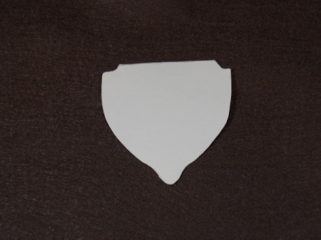 Acorn template on dark brown felt square.